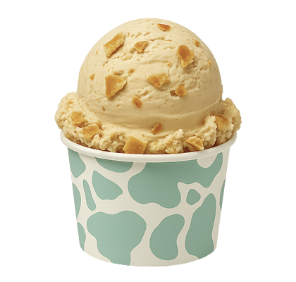 Ice cream scoop with cookie pieces in a paper cup with a green and white pattern on a white background
